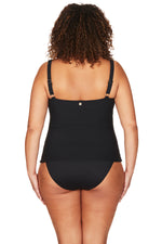 A plus size curvy shopper from Toronto Canada is wearing a  Aria Botticelli Slimming Tankini and slimming high waist bikini bottoms purchased from Sun Vixen Swimwear to look fit on her Caribbean cruise. She shops premium supportive swimwear that smooths her belly pooch, shapes her waist, and offers elegant coverage without losing style. Sun Vixen is popular among luxury swimwear customers from Chicago, Los Angeles, Miami, Boston, and Seattle searching for the womens tummy control plus size swimwear online