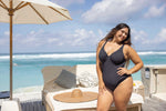 A curvy woman from Vancouver is spending the week at a luxury resort in Jamaica, wearing cut out swimsuit Plus Size Aria Giotta Artesands luxury underwire one piece, premium tummy control swimwear, curvy sculpting fit, and supportive design for sagging breasts that ensures a polished silhouette in all her travel photos. Sun Vixen shoppers across Toronto, San Francisco, Calgary, Miami,  Canada and USA buy this swimsuit for upscale vacations in Turks and Caicos, Maui, Maldives, Cabo, for luxury plus size swim