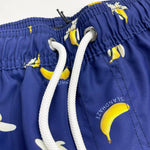 Banana Swim Trunks Island Haze Tropical print Mens Shorts cool print funny shorts navy blue 5 inch inseam elastic waist drawstring front inner mesh lining side pockets back velcro close pocket quick dry soft fabric unique lucky banana swim short lively print vacation beach vibe vacation hilarious couples trip joke ridiculous guys blue navy unusual popular best mens swim good price ships fast buy canada usa life of the party goofy travel online shopping enthusiast beauty maven gym goer travels often joker  