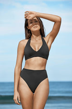 Black Halter Bikini Top Sea Level Australia Essentials D/D halter bra by sea level Australia worn by a lady from High Waisted Swimsuit Bottoms With Tummy Control Essentials retro high waist pants. She shops online for supportive swimsuits designed with slimming shape wear fabric on sun vixen swimwear Edmonton. Luxury shoppers in Windsor, Bakersfield. Buy classy black bikinis with shaping slimming full coverage bikini bottoms, elegant high leg swimsuits, best black bikinis USA Canada online boutique swimwear
