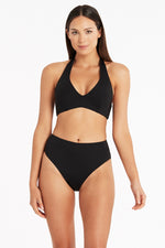 Black Halter Bikini Top Sea Level Australia Essentials D/D halter bra by sea level Australia worn by a lady from High Waisted Swimsuit Bottoms With Tummy Control Essentials retro high waist pants. She shops online for supportive swimsuits designed with slimming shape wear fabric on sun vixen swimwear Houston. Luxury shoppers in Windsor, Bakersfield. High quality tummy control fabric makes this luxury black bikini set the most flattering beach look for a fashionista travelling to Hawaii beach villa, mexico