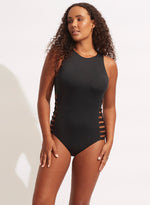 Black high neck one piece swimsuit sustainable seafolly edgy cutout sides sexy rocker glamorous sophisticated unique fancy covers upper chest for sensitive skin minimizes sun exposure full coverage bottoms zip back high quality luxury fabric designer made long zipper pull easy on/off outdoor swimsuit water cute pretty elegant unusual highly rated 5/5 eco friendly fabric beach traveller resort beauty maven frequently buys online fashionista shopping enthusiast recently purchased luxury beach fashion padded