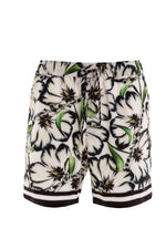 Floral Swim Trunks | Agua Bendita Joe Giard 3 pocket swim shorts getaway bahamas best designer mens swimwear online soft fabric gay style buy designer swim for dudes online canada unique cool vacation shorts ships michigan gay mid length elastic waist fashionable pattern hip comfortable expensive good quality guys luxury swimwear fast shipping toronto italian style best mens swimwear online top rated site google unique influencer good quality flower print cool looking outfit white navy mexico trip confident