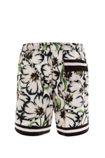 Floral Swim Trunks | Agua Bendita Joe Giard 3 pocket swim shorts getaway bahamas best designer mens swimwear online soft fabric gay style buy designer swim for dudes online canada unique cool vacation hawaii unique stylish fashionable pattern hipster look comfortable expensive good quality guys luxury swimwear fast shipping toronto italian style best mens swimwear online top rated site google unique influencer good quality flower print cool looking outfit white navy mexico trip confident