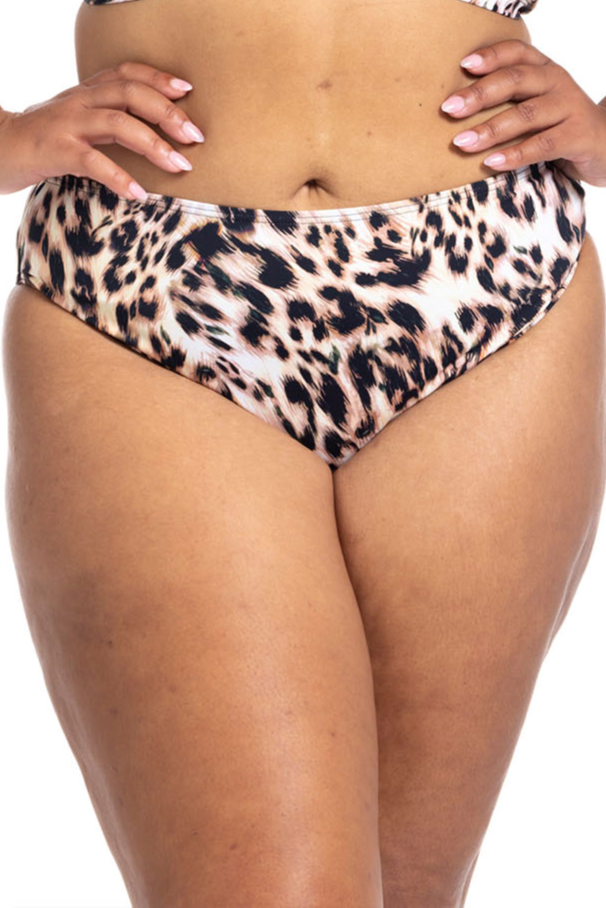 A plus size woman from Winnipeg is on her beach holiday in the Cayman Islands wearing Leopard Bikini Bottoms Artesands saphare chagall with the tummy control mid rise fit that smoothes her waist and flatters her curves. She shops at Sun Vixen Swimwear online boutique  website for luxury plus size swimsuits, sexy animal print bikinis, designer womens swimwear top rated in Canada USA in cities Toronto Phoenix Vancouver Houston Montreal for flattering swimsuits and good quality bikini tops for sagging bust