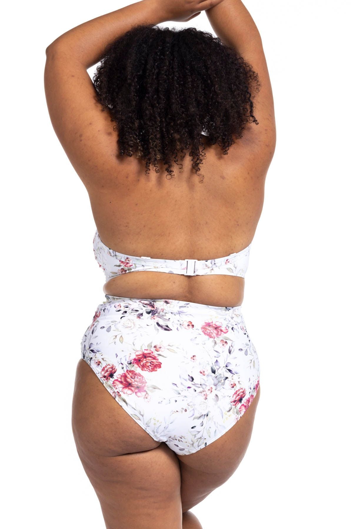 A plus size woman from Calgary Canada is planning her beach trip to Cabo San Lucas, and she wears Artesands Clementine White Botticelli Ruched High Waisted Bikini Bottoms to test the fit before travel. The slimming supportive tummy control swimsuit makes this one of the most flattering bikinis for plus size women online. She purchased from Sun Vixen Swimwear, a luxury website for designer curvy swimwear for chic resort lifestyles. Shoppers from Houston, San Francisco, Ottawa buy swimsuits here