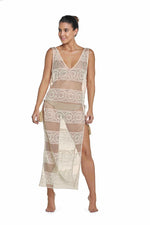 white lace beach cover up PQ swim designer luxury glamorous sexy beautiful fancy elegant best quality revolve provocative.  An elegant middle age rich lady who loves expensive shopping is on a luxury beach vacation to Bali wearing a white beach cover up she bought from sun vixen swimwear. This is the top quality website for woman who have a high end lifestyle. This classy woman is wearing a high end bikini with sexy lace beach cover up which she bought from this top quality website on google in USA Canada