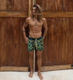 Italian Swim Trunks Sustainable Baroque | SegSea Italian Swim Trunks Sustainable Baroque SegSea sexy mens swim shorts high end made in canada 3 inch inseam cool fabric rich successful man fashionable unique sexy mens swim shorts influencer high end luxury designer confident gay man swim shorts short length top dog look highest quality 3 pockets eco friendly cool swim shorts mens sustainable repreve recycled plastic water bottles successful gay man look army green baroque print unique sexy gay mens swim