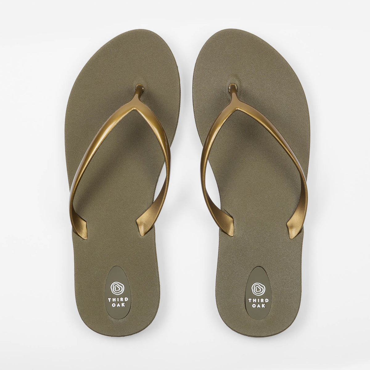 Sandals Scout Metallics Third Oak shimmer finish vegan cruelty free sturdy design made with bio based material 45% soy 100% recyclable made in the USA eco friendly flats flip flops stylish shiny cute clearance sale online vacation good quality american made eco safe environmentally friendly best flats vacation open toe thongs good quality buy online clearance sale neutral color army green gold beach shoes dressy cute pretty elegant versatile dress up or down comfortable good travel carry on shimmer 
