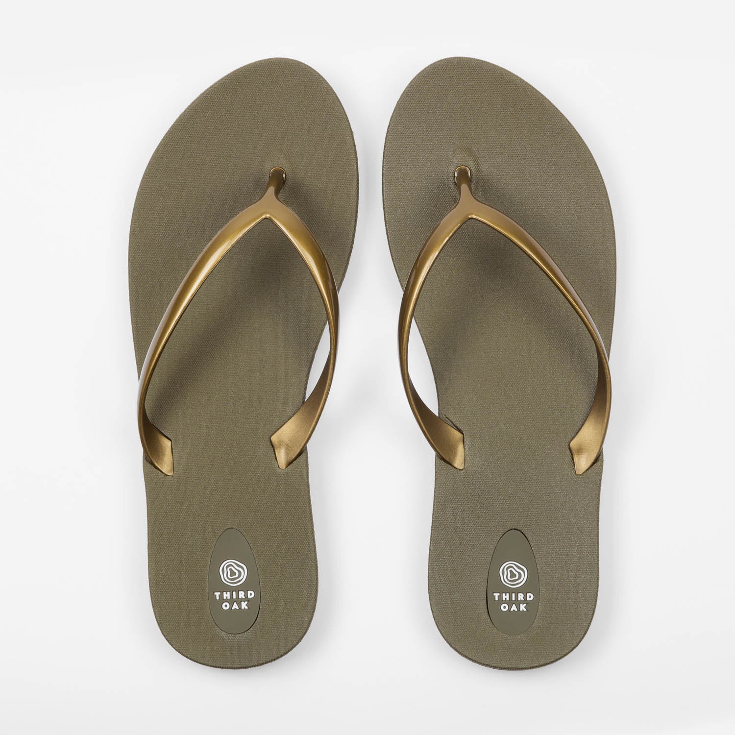 Sandals Scout Metallics Third Oak shimmer finish vegan cruelty free sturdy design made with bio based material 45% soy 100% recyclable made in the USA eco friendly flats flip flops stylish shiny cute clearance sale online vacation good quality american made eco safe environmentally friendly best flats vacation open toe thongs good quality buy online clearance sale neutral color army green gold beach shoes dressy cute pretty elegant versatile dress up or down comfortable good travel carry on shimmer 