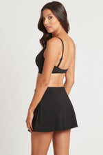 Tummy Control Swim Skirt | Sea Level Australia Essentials Swim Skirt Black High end timeless black swim skirt stylish flattering luxury designer covers upper thighs compression sustainable eco friendly good quality sexy inner lining full coverage bottoms vacation beach buy online great quality sophisticated ladies swimsuits womens where to buy high waist tummy control highly rated online swimwear canada usa slimming sophisticated beautiful quality luxury brand resort beachwear website plus size cute fancy 