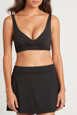 Tummy Control Swim Skirt | Sea Level Australia Essentials Swim Skirt Black High end timeless black swim skirt stylish flattering luxury designer covers upper thighs compression sustainable eco friendly good quality sexy inner lining full coverage bottoms vacation beach buy online great quality sophisticated ladies swimsuits womens where to buy highly rated online swimwear canada usa slimming sophisticated beautiful quality luxury brand resort beachwear website plus size cute fancy size 12 skirt swim sexiest