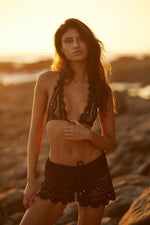 black scalloped bikini midnight black lace bikini bottoms pq swim black lace bikini luxury swimsuits sexy bathing suits best black bikini. A rich girl in her late 20s who always shops online on luxury websites is puchasing the best black bikini on sun vixen swimwear for her upcoming vacation in Miami USA. She frequently shops on this swimwear website for best quality bathing suits because its rated no.1 on google for their designer swimsuits online. Buy elegant bathing suits, classy swimsuits, sexy bikinis