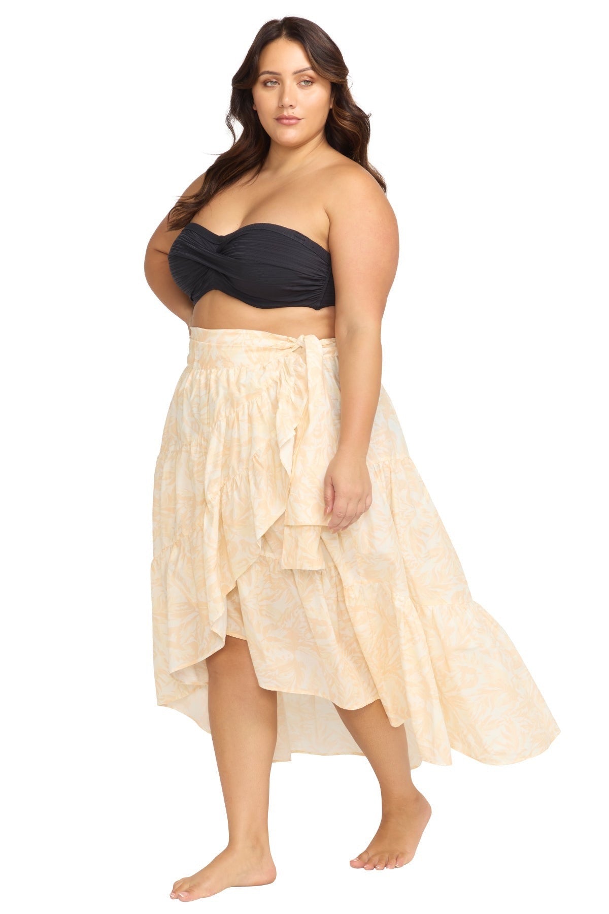 A curvy woman from Montreal is on a luxury escape in Turks and Caicos wearing the Artesands Areca Cea Elgar high low boho wrap skirt, a sexy plus size beach cover up skirt ranked among the best luxury designer swim skirts, high end glamorous resort skirts, fancy tie wrap skirts, and exquisite beachwear pieces at Sun Vixen Swimwear. Women across Toronto, Vancouver, Miami, New York, and the USA choose this luxury boho beach skirt searching for premium vacation outfits, stylish fashionable resort cover ups 