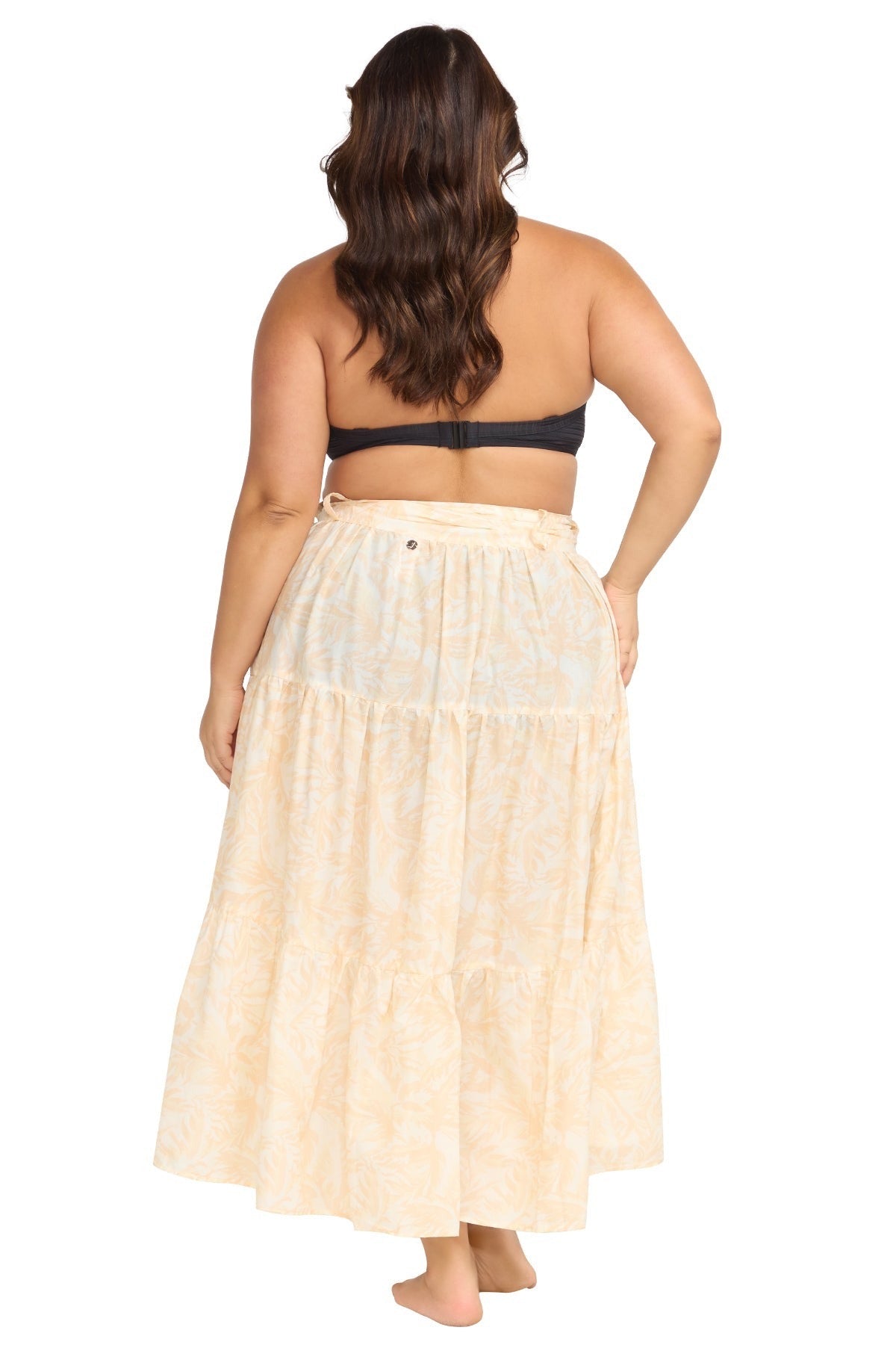 A stylish traveler from Vancouver is relaxing in Maldives wearing the Areca Cea Elgar high low Artesands swim wrap skirt, a luxe boho skirt trending among women who want luxury resort skirts, plus size sexy high low beach cover ups, elegant designer tie skirts, and premium resort wear for warm destinations. She loves that Sun Vixen Swimwear carries fashionable high end wrap skirts, boho luxury beachwear, and best quality resort outfits, popular across Canada and the USA for vacations to Turks and Caicos