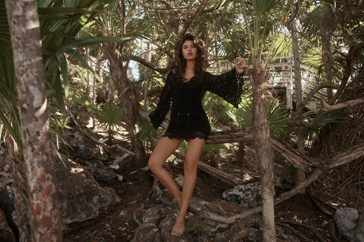 beach cover up black noah tunic PQ Swim sheer lace bikini cover up dress luxury popular provocative quality revolve sexiest beachwear sheer lace bikini cover up dress handcut italian lace mini dress sexiest black seethrough glamorous sophisticated elegant sexy bold  edgy designer high end super soft italian fabric lace up front ties soft scalloped edges mesh bombshell rich looking best quality womens online shopping enthusiast purchases luxury goods often buys frequently travels often beach resort outfit 