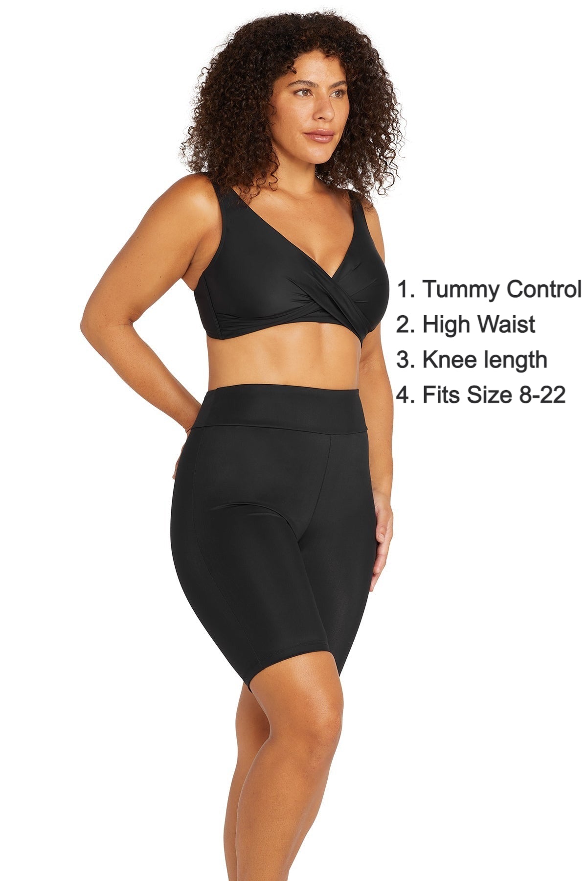 A woman from Chicago is staying at a beachfront hotel in Bali wearing her Artesands Michelangelo knee length swim bike shorts, best tummy control swim bottoms, luxury compression shorts, sustainable designer pieces, and sophisticated stylish womens swim shorts at Sun Vixen Swimwear. She loves the support, and high end resort look these shorts give her for beachfront workouts, long swims, and island outings. Women across Vancouver, Toronto, Atlanta, San Diego USA shop these fancy exquisite swim shorts online