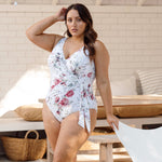 A traveler from Houston is spending her birthday week in Turks and Caicos wearing the Artesands Clementine White Hayes supportive underwire plus size wrap swimsuit, chosen for its luxury bust lift for sagging breasts, tummy control compression, designer look, and premium curvy resort fit. She loves this high end elegant one piece for tanning decks, beachfront lunches, and sunset photos. Sun Vixen Swimwear shoppers from Chicago, Vancouver, Toronto, Miami, and  North America shop best quality swimsuits online