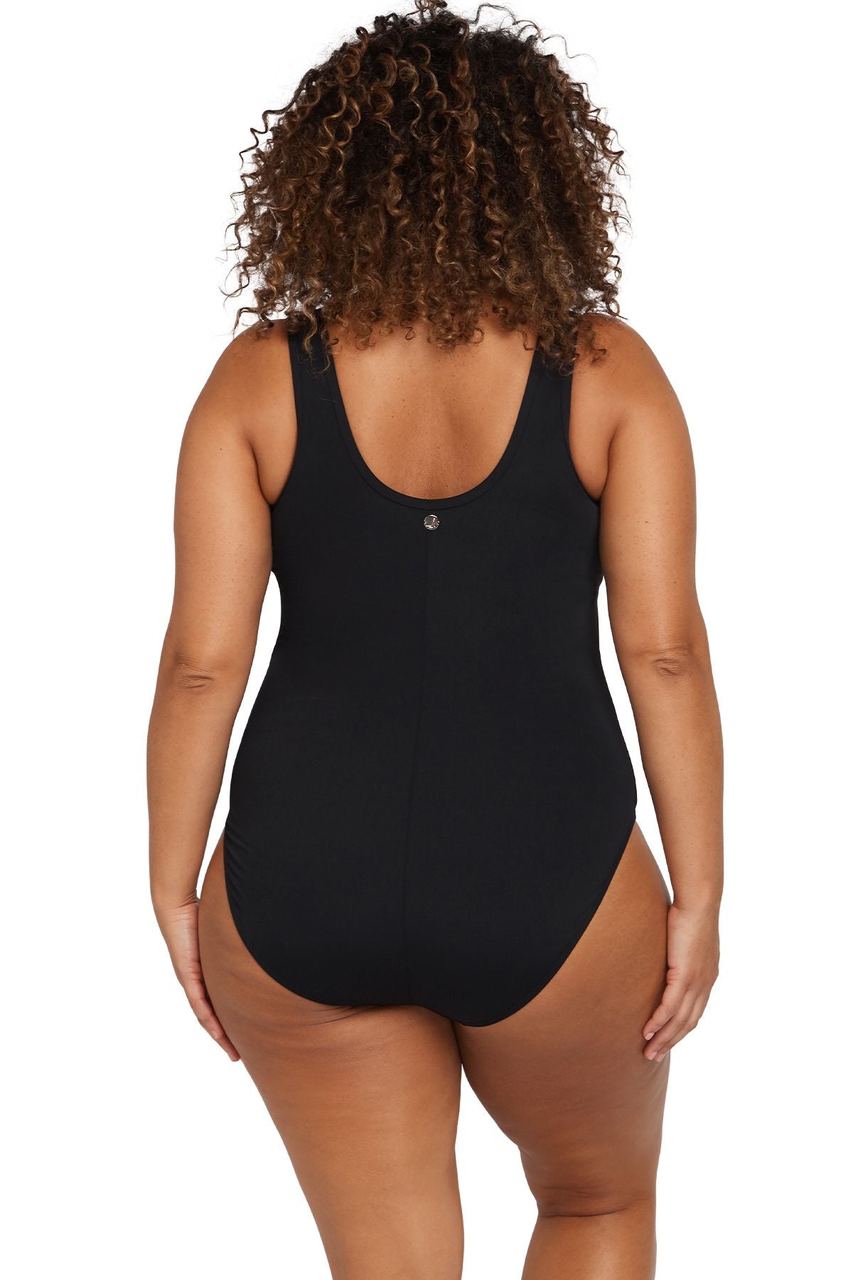 A plus size woman from Dallas USA wears the Artesands Natare Fuseli Zip One Piece to her luxury resort in Cancún, choosing the black tummy control swimsuit because it gives her that sculpted hourglass shape. She purchased this designer curvy swimwear from Sun Vixen Swimwear USA Canada, known for high end flattering swimsuits for women who appreciate quality, support, and elegance. Shoppers from Edmonton and Quebec City also love this piece swimsuit for upscale vacations in Santorini and Turks and Caicos