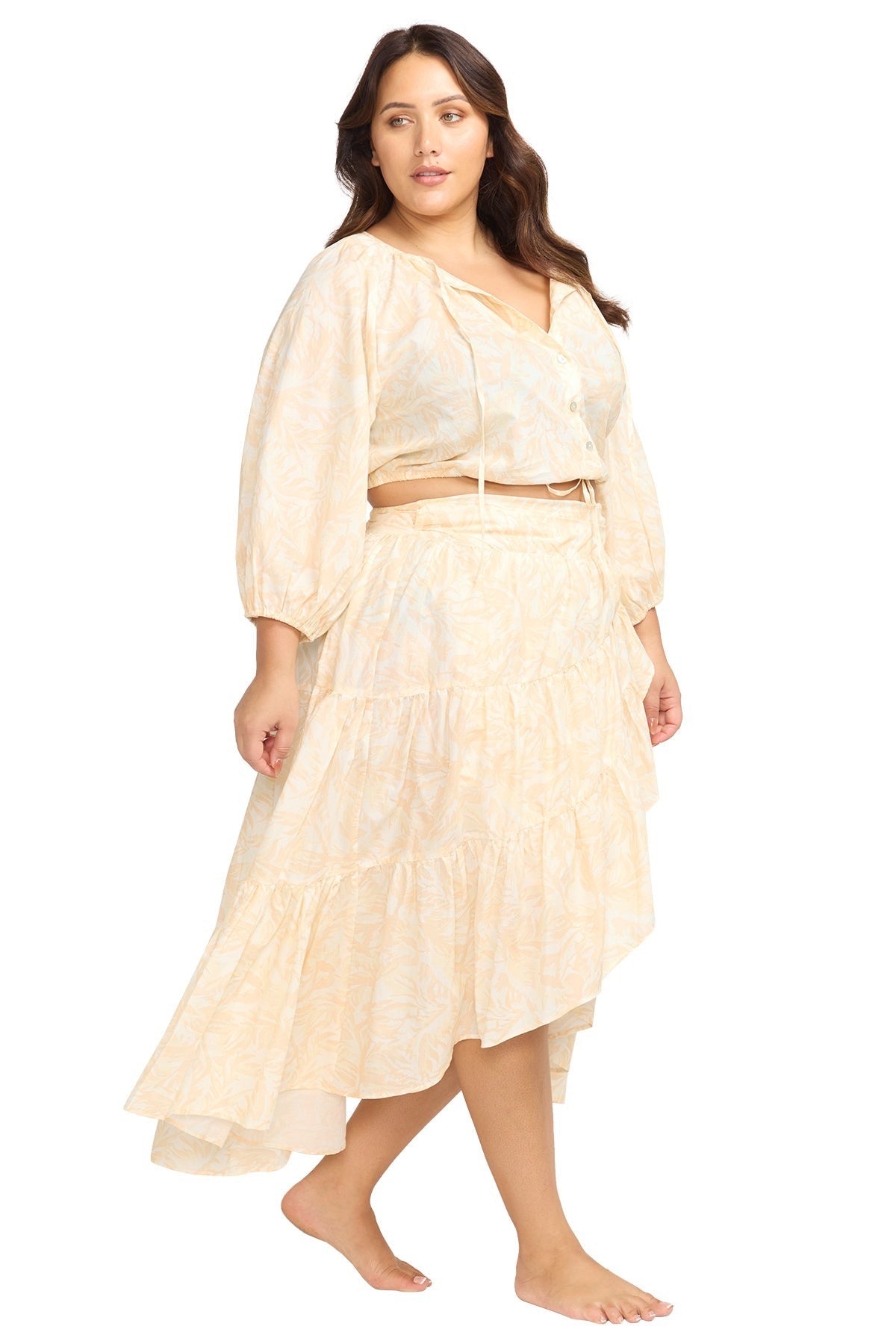 A stylish woman from New York City is lounging at her private villa in Bali wearing the boho Artesands Areca Cea Elgar high low swim wrap skirt, one of the most searched luxury plus size wrap skirts, sexy boho beach skirts, glamorous designer cover up skirts, and high end resort wear pieces at Sun Vixen Swimwear. Women from Vancouver, Calgary, Los Angeles, Dallas, and across North America choose this exquisite tie wrap skirt for luxury beach vacations, fancy resort outfits, and warm destinations Mexico 