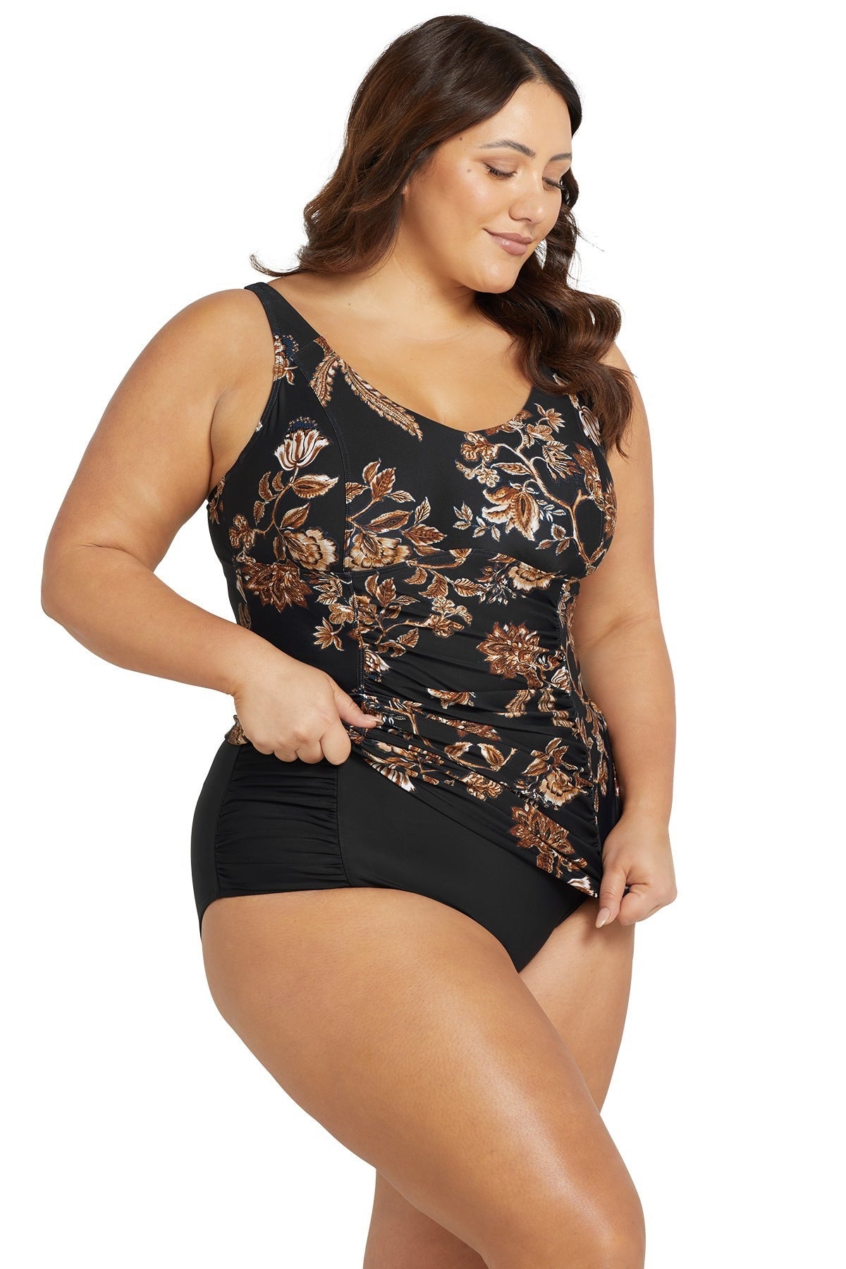 A stylish curvy woman is wearing a Underwire Tummy Control Tankini Top Chantique Raphael E/F Artesands on high end resort vacation. she purchased her sexy slimming tankini top and black mid rise bikini tummy control from sun vixen swimwear boutique website. Its a popular retail store for high income individuals who spend money on good quality bathing suits, flattering swimsuits for their apple shape body type, best swimsuits for sagging bust. Women from Toronto, Vancouver, New York, Fort worth shop here