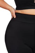 A curvy woman from New York City is exploring Tulum in her Artesands Michelangelo knee length swim bike shorts, purchased for their luxury tummy control, sustainable designer quality, compression fit, best quality craftsmanship, and sophisticated resort style. She loves wearing these glamorous high end womens swim shorts for beach walks, poolside relaxing, and tropical adventure days. Sun Vixen Swimwear customers across Vancouver, Toronto, San Francisco, Miami, and North America shop these slimming shorts