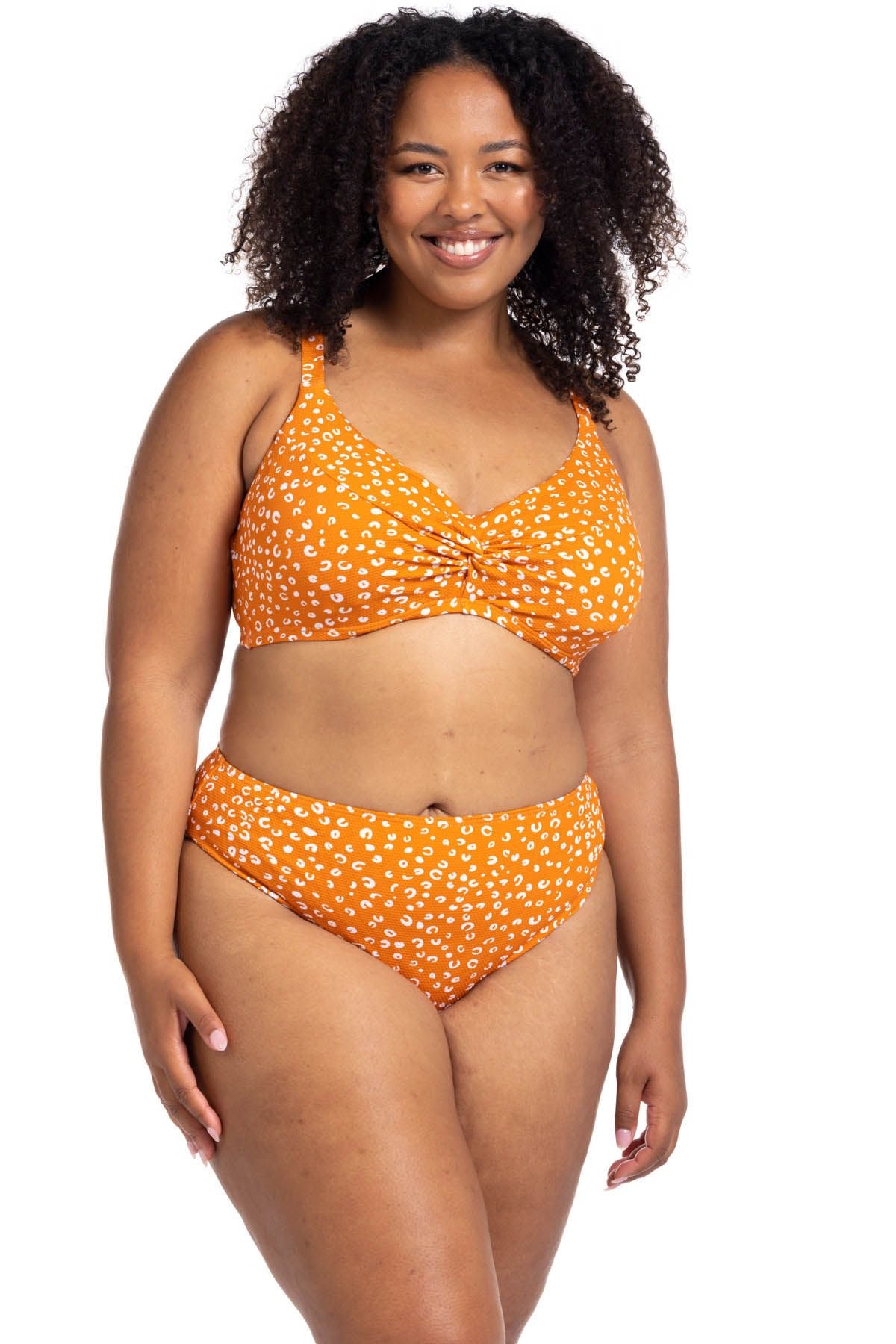 A curvy woman in Montreal booked a winter escape and packed the Copper Monet cheetah print bikini set from Artesands for her hotel spa. She loves how the underwire soft cup top gives her support and lift while the tummy control high waist bikini bottoms smooth her curves beautifully. She ordered it from sun vixen swimwear because she wanted a designer plus size swimsuit, womens swim, slimming bikini with a sophisticated sexy vibe. She feels pampered, stylish, slim and confident on her luxury resort holiday