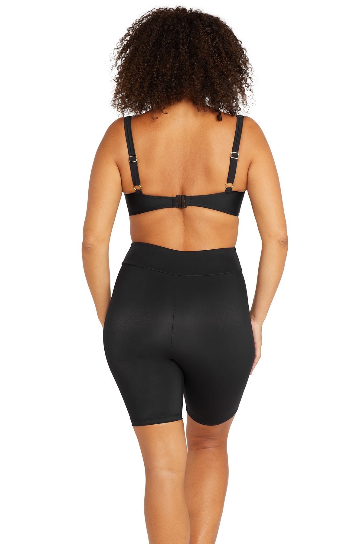 A stylish woman from Seattle is spending her birthday in Hawaii wearing the Artesands Michelangelo knee length swim bike shorts, sustainable luxury swim bottom loved for its tummy control, high end compression, good quality designer construction, and sophisticated fashionable resort look. She purchased them from Sun Vixen Swimwear for active beach travel, long ocean swims. Women across Calgary, Toronto, Los Angeles, Miami, and the USA search for these shorts when they want best quality resort shorts online