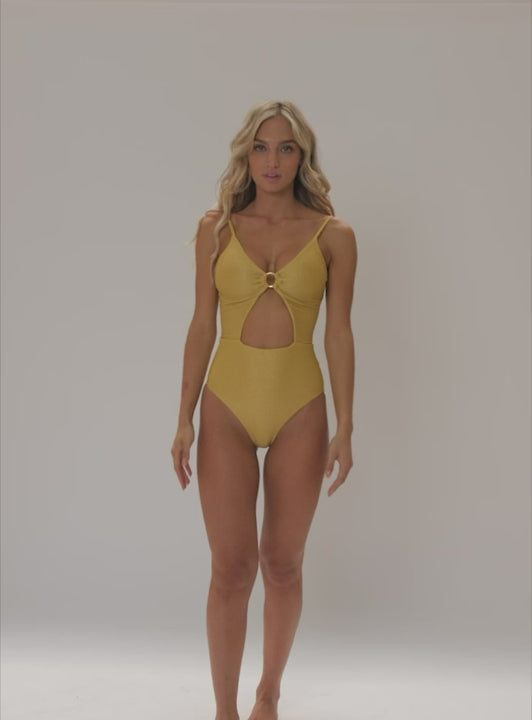 shop PQ Swim one piece gold coast maisie ring Cut Out Monokini shiny high quality hot hottest instagram luxe luxurious luxury one piece swimsuits Cut Out Monokini Gold PQ Swim gold coast maisie ring one piece pq swim ribbed italian shimmer fabric full coverage bottoms adjustable shoulder straps gold ring front retro vibe shiny gold thread removable pads fully lined adjustable back ties sexy sparkly fabric high end designer pretty golden unique shiny vibrant shimmery cut out front high waist look back luxury