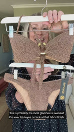 bronze bikini top with bronze swimsuit bottoms complete this bronze bathing suit set designer made in USA by Sauvage unique strapless stylish swimwear deluxe elegant shimmer fabric italian gold snake ring front bandeau top high leg shimmer full coverage shiny bikini bottoms elegant sophisticated stylish pool party high end luxury resort fashion rich girl attractive unique sexy provocative edgy flattering upscale hottest instagram influencer real housewives celebrity style glamorous diva goddess bikinis luxe