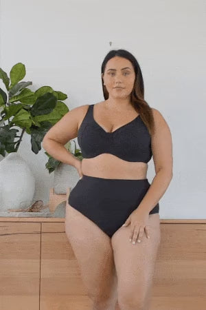 A plus size curvy woman from Los Angeles USA is wearing a  Aria Botticelli Slimming Tankini Swimsuit Set Plus Size Artesands to look slim and toned for her weekend spa retreat. She shops Sun Vixen Swimwear for high quality supportive plus size bathing suits, luxury tummy control styles, and flattering curvy fits because she likes looking polished and feeling held in. This boutique website popular amongst shoppers from Toronto, New York, Miami, Dallas, Seattle, Long Beach, Bakersfield, Santa Ana, Vancouver
