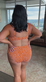 A plus size woman from Toronto flew to a warm resort for a weekend getaway and packed the Copper Monet cheetah print tummy control bikini set from Artesands she ordered from sun vixen swimwear usa canada. She wanted something sexy but sophisticated, and the soft cup underwire top shapes her bust while the high waist slimming bikini bottoms contour her waist. She’s sipping champagne by the pool feeling grateful she found a boutique with stunning designer curvy swimwear styles online for stylish rich women