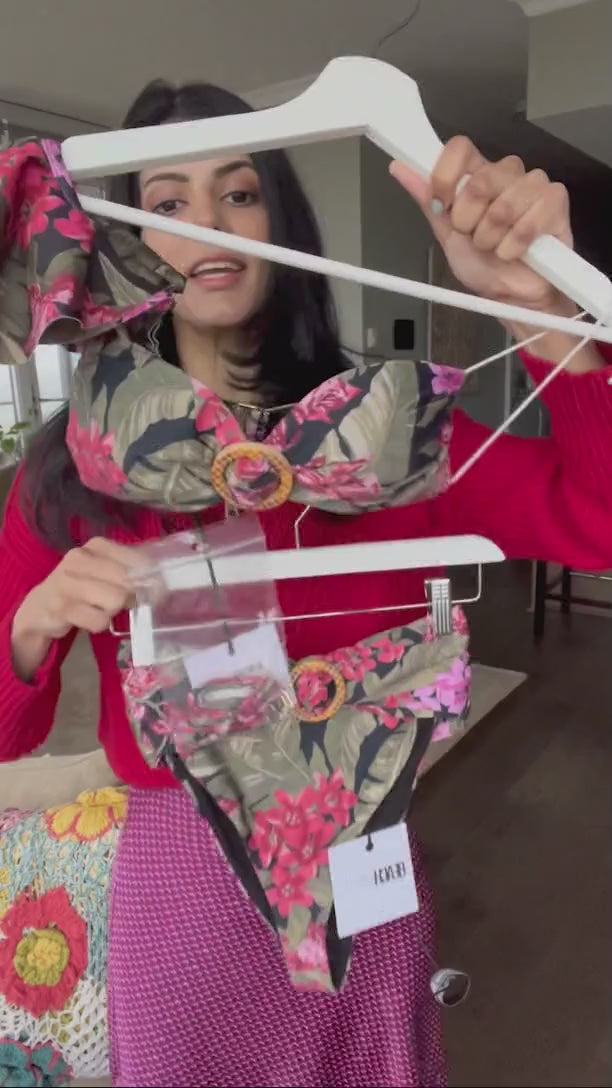 a rich woman from Dallas Texas is looking stunning wearing a Fuschia Orchid Rita Top Beach Riot Ruffle Shoulder Swimsuit Belted Bikini Bottoms Tropical Beach Riot Fuschia Orchid Halle Bottoms on her beach vacation in Tulum Mexico. She is a quality luxury shopper that shops frequently on sun vixen swimwear to look on trend on her luxury beach vacations. She also purchased for classy one shoulder bikini tops, high end gucci  inspired bathing suits, high waist bikini bottoms for her 5 star resort holiday 