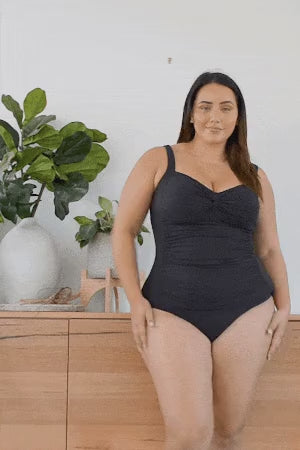 Plus size woman from Philadelphia USA is wearing Aria Botticelli Slimming Tankini Swimsuit Set Plus Size Artesands to flatten her belly pooch she bought online from sun vixen swimwear a luxury boutique website for best tummy control swimsuits, slimming womens bathing suits. She is luxury shopper for good quality bathing suits for beach trips, resort vacation. Top rated swimwear store has 5 star ratings. Customers from Toronto, Montreal, New York, Dallas, Washington love it for sexy slimming tankini tops