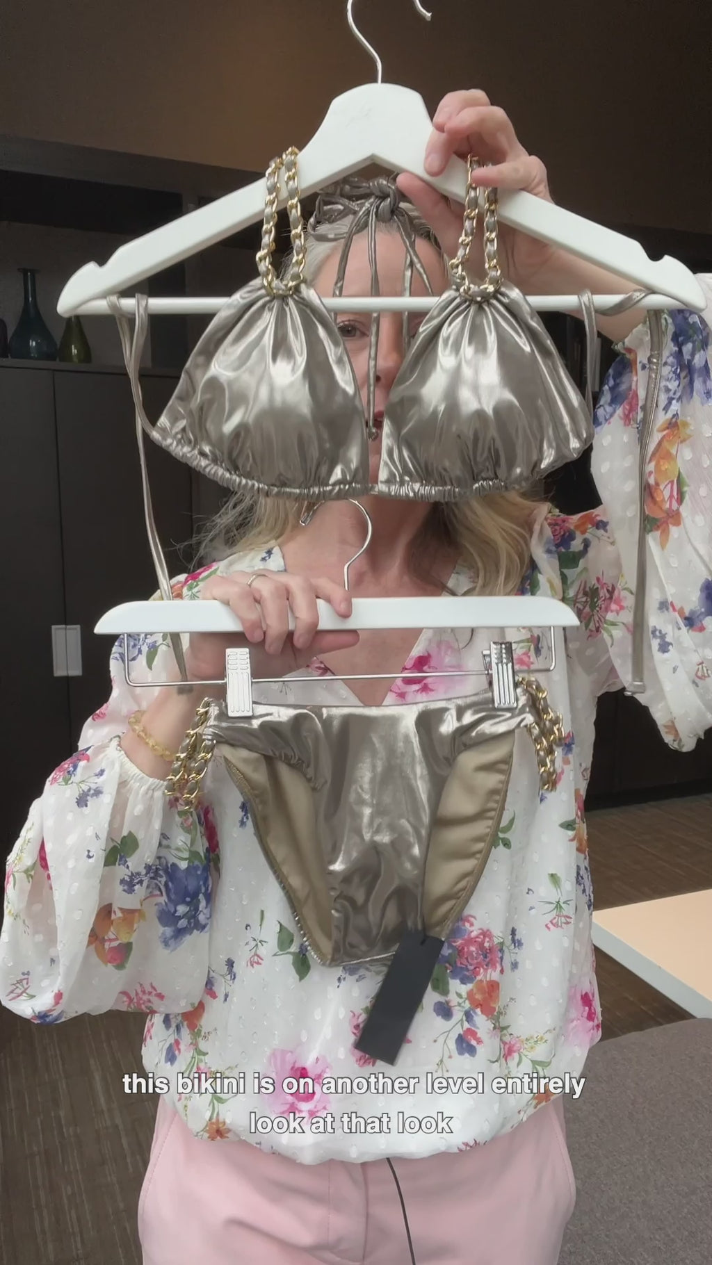 Want to look like a celebrity? Buy this high end fashion shiny metallic bikini set made with quality italian fabric finished with gold chain accents to the halterneck triangle top and sides of the full coverage bottoms. Designer bikini made in the USA by sauvage and sold online by sunvixen.com a quality swimwear retailer located in Canada selling designer swimwear to thousands of customers in the USA & Canada, italy, Australia, Belgium, France, New Zealand, Greece, Spain and many other countries worldwide. 