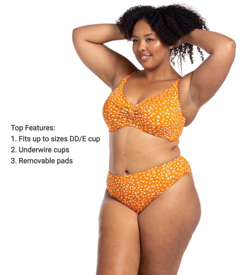 A woman celebrating her birthday in Tulum is stepping into her resort pool wearing the Artesands Copper Monet plus size bikini set featuring a sculpting high waist tummy control bottom and soft cup underwire top she bought from sun vixen swimwear. The cheetah print makes her feel bold and glamorous, and the supportive structure gives her a sexy slimming fit she’s proud to wear. She loves luxury designer swimwear that elevates her curves and gives her a striking high end classy beach vacation look