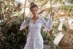 White Lace Cover Up PQ Swim Noah Tunic luxury popular provocative quality revolve sexiest sophisticated high end bikini stylish beachwear.  A woman from Montreal is on the beach looking stunning in her white sheer beach cover up from PQ swim. She bought this name brand cover up from sun vixen swimwear, the best online retailer for designer swimsuits in USA, Canada & worldwide. She frequently shops from this top quality google store for stylish luxury bikinis, sexy swimsuits, high end beach cover ups online 