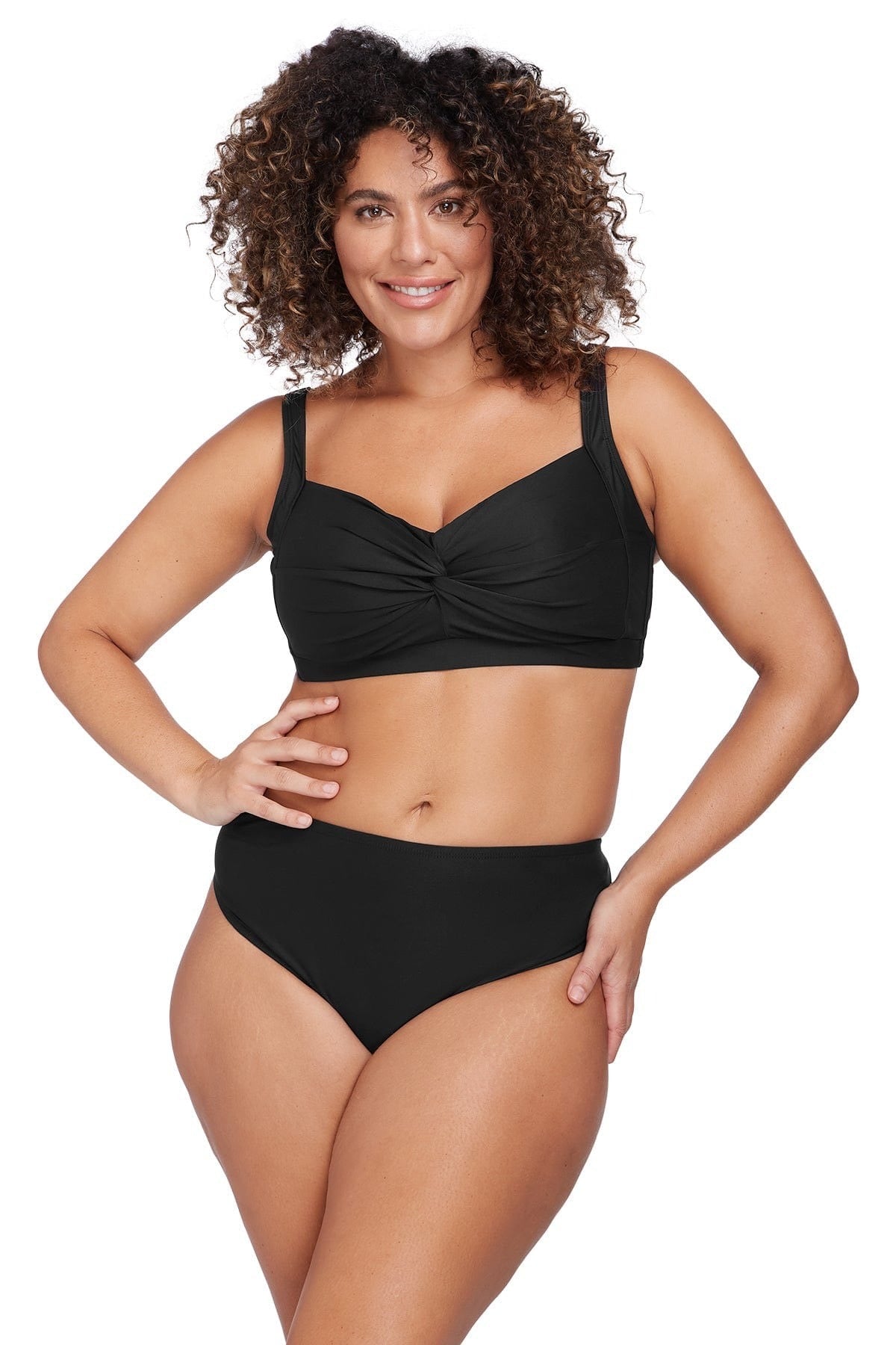 A glamorous curvy woman from Bakersfield wearing Mid rise tummy control bikini bottoms Artesands with tummy control tankini on a resort vacation. She bought her sexy slimming tankini top and black slimming bikini bottoms from sun vixen swimwear boutique website. Its a top rated retail store for luxury shoppers who want name brand good quality bathing suits, best plus size swimsuits for their apple shape body type, best swimsuits for large bust and big belly. Women from Montreal, Tampa, Vancouver shop here