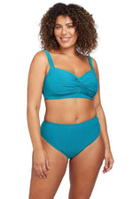 A glamorous plus size shopper from Los Angeles California chose the Rhapsody Teal Botticelli underwire bikini top with high waist tummy control bikini bottoms by Artesands for her poolside getaway, loving how supportive, smoothing, and sexy bikini looks. She got this classy womens designer swimwear at Sun Vixen Swimwear Canada, a boutique she trusts for the most flattering swimsuits for bigger women, tummy control curvy swimwear, and high end plus size bathing suits that feel chic, modern, and sophisticated