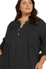 A woman from Montreal is celebrating her birthday on the beaches of Turks and Caicos wearing the Artesands black Gershwin long sleeve cover up, chosen as her go-to luxury oversized black beach shirt, best high quality designer cover up, and stylish flattering black resort layer from Sun Vixen Swimwear. She loves its luxe fashion look, and make her swimsuits appear more elegant, expensive, high end, and glamorous. It’s most searched black shirt beach cover ups among women in USA Canada North america online