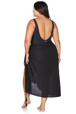 A curvy woman from Toronto is on a luxury getaway in Turks and Caicos wearing the long black Artesands beach sarong, a sexy sheer black bikini cover up trending as one of the hottest luxury sarongs, best high end black beach cover ups, and most glamorous stylish vacation accessories at Sun Vixen Swimwear. She loves how this elegant upscale black sarong transforms her swimsuit into a fashionable, exquisite resort outfit perfect for beach clubs, infinity pools, and sunset cocktails. Ships across Canada USA