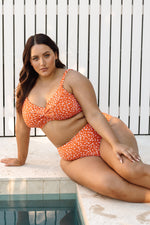 A stylish plus size woman in New York chose the Copper Monet cheetah print bikini set from Artesands because she wanted something sexy slimming and supportive for her spa day. She purchased it from sun vixen swimwear usa canada after searching for flattering plus size swimsuits that look high fashion. Underwire bikini top gives supportive shape while the high waist tummy control bikini bottoms make her look toned slimmed. She feels confident walking through the spa, designer animal print makes her look chic