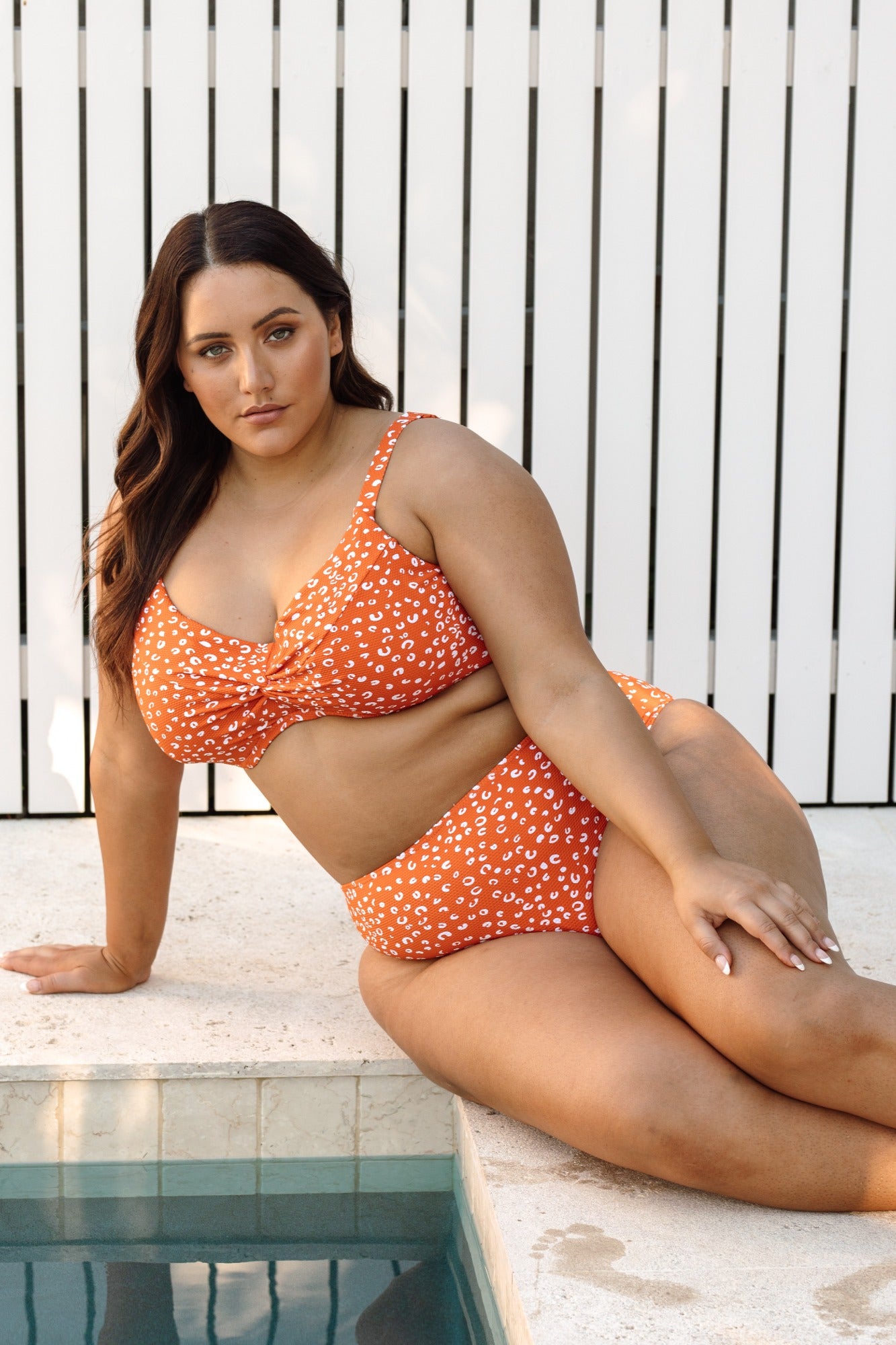 A stylish plus size woman in New York chose the Copper Monet cheetah print bikini set from Artesands because she wanted something sexy slimming and supportive for her spa day. She purchased it from sun vixen swimwear usa canada after searching for flattering plus size swimsuits that look high fashion. Underwire bikini top gives supportive shape while the high waist tummy control bikini bottoms make her look toned slimmed. She feels confident walking through the spa, designer animal print makes her look chic