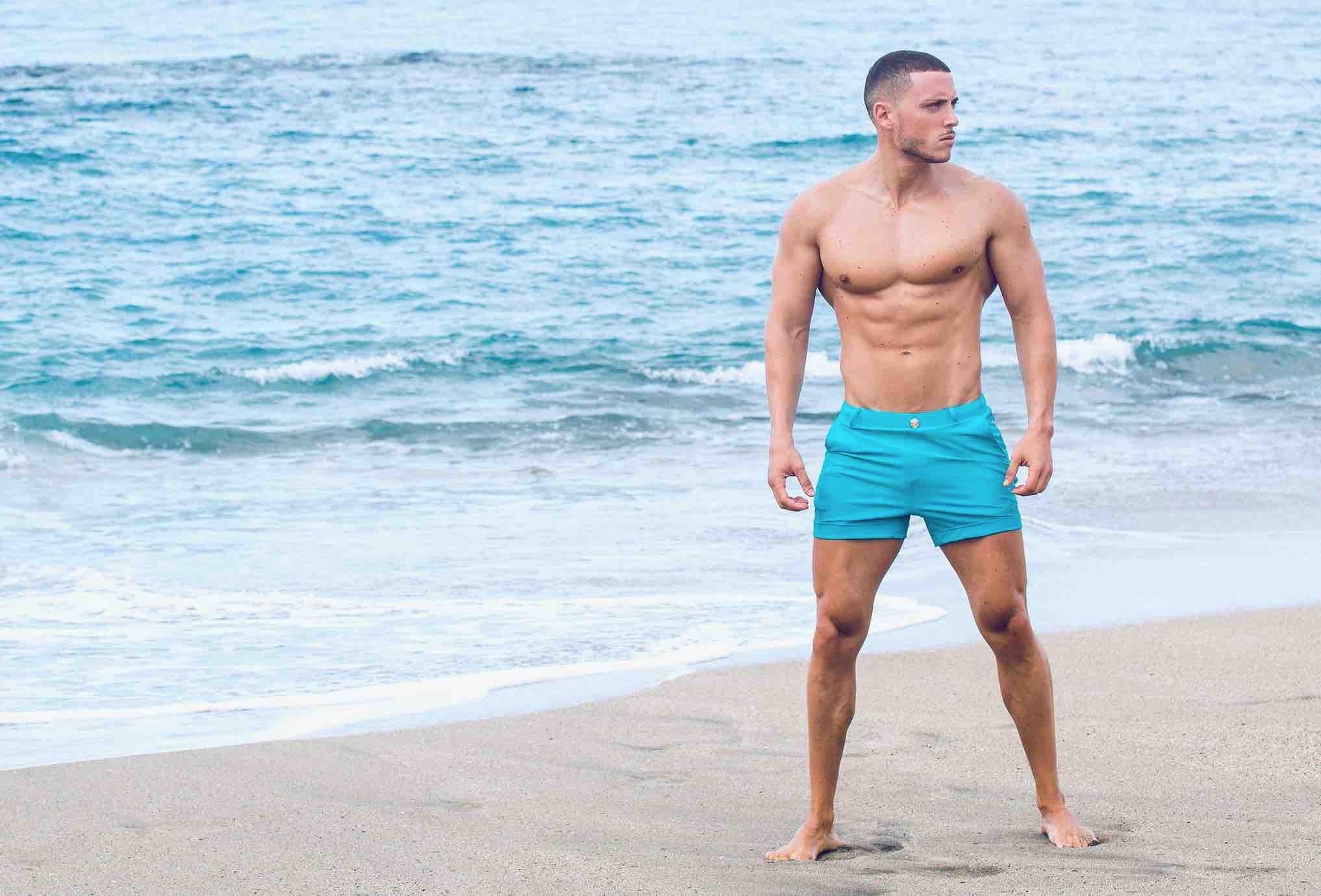 At a five star resort in Cancun, a man from New York is wearing euro swim trunks. He bought his high end men's swimwear from Sun Vixen Swimwear, an upscale online boutique for premium swimwear. This swimwear boutique website sells the best designer men's swim trunks, luxury swim shorts for men, exclusive men's swimwear, vacation swimwear for men, best swimwear for luxury vacations, mens designer swim trunks, high end swim trunks for travel online with fast delivery in USA and Canada 