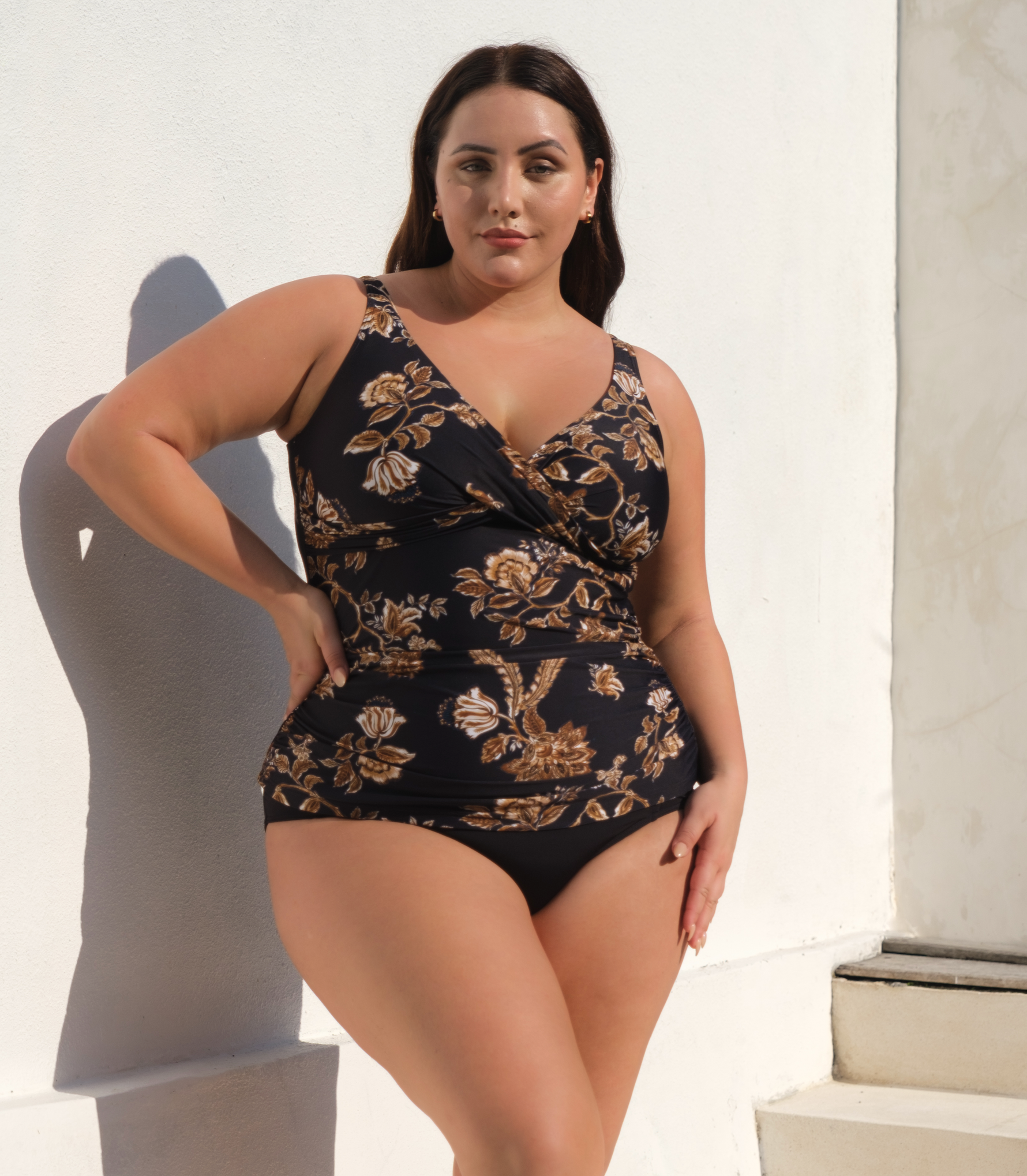 A plus size woman from Toronto, Canada is wearing a designer plus size tankini top on her coastal retreat. To shop this look buy plus size luxury swimsuits online and purchase designer plus size swimwear for curvy women. Sun Vixen Swimwear collection features sexy, attractive awesome luxury swimwear to slim and hide tummy bulge.  With best quality, our boutique bathing suits offers a classy bikinis and sophisticated one piece swimsuits luxury bathing suits plus size high end swimwear online  