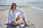 elegant exotic expensive White Lace Cover Up PQ Swim Noah Tunic beautiful best quality boutique classy designer swimwear online. a Canadian woman from Vancouver is wearing a sexy white cover up at a resort in puerto Vallarta mexico. Luxury fashionistas who shop on Sun Vixen Swimwear website purchase upscale bathing suits sexy swimsuits online. This swimwear retailer located in Canada sells high end swimsuits, good quality bikinis, fashionable swimwear online to high income customers located in USA & Canada