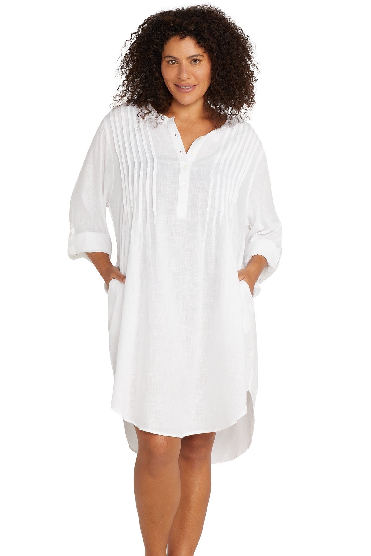 A woman from Vancouver is on a luxury beach vacation in Cabo San Lucas wearing the white long sleeve Gershwin over shirt cover up Artesands sexy, classy designer beachwear piece trending as one of the best high quality white bikini cover ups for resort travel. She bought it from Sun Vixen Swimwear for its luxury beach outfit look, high end resort fashion, and polished style that works for pool days, beach clubs, and seaside dinners. This white cover up is popular across Canada for travelers wanting luxury